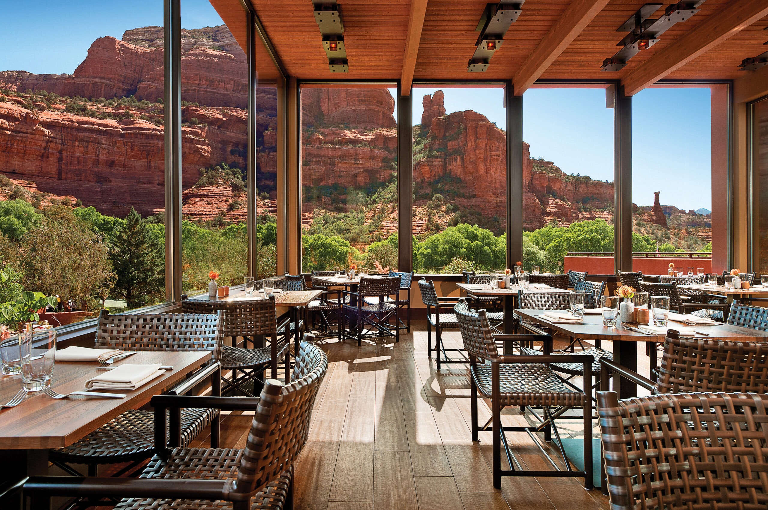 Tii Gavo restaurant interior with floor-to-ceiling canyon views