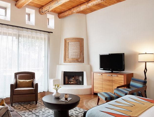 Casita interior with warm wood tones and fireplace